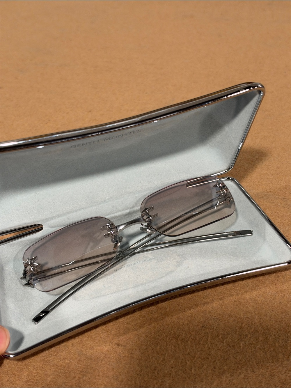 GENTLE MONSTER Men’s Rimless Silver Frame Sunglasses with Grey Lenses